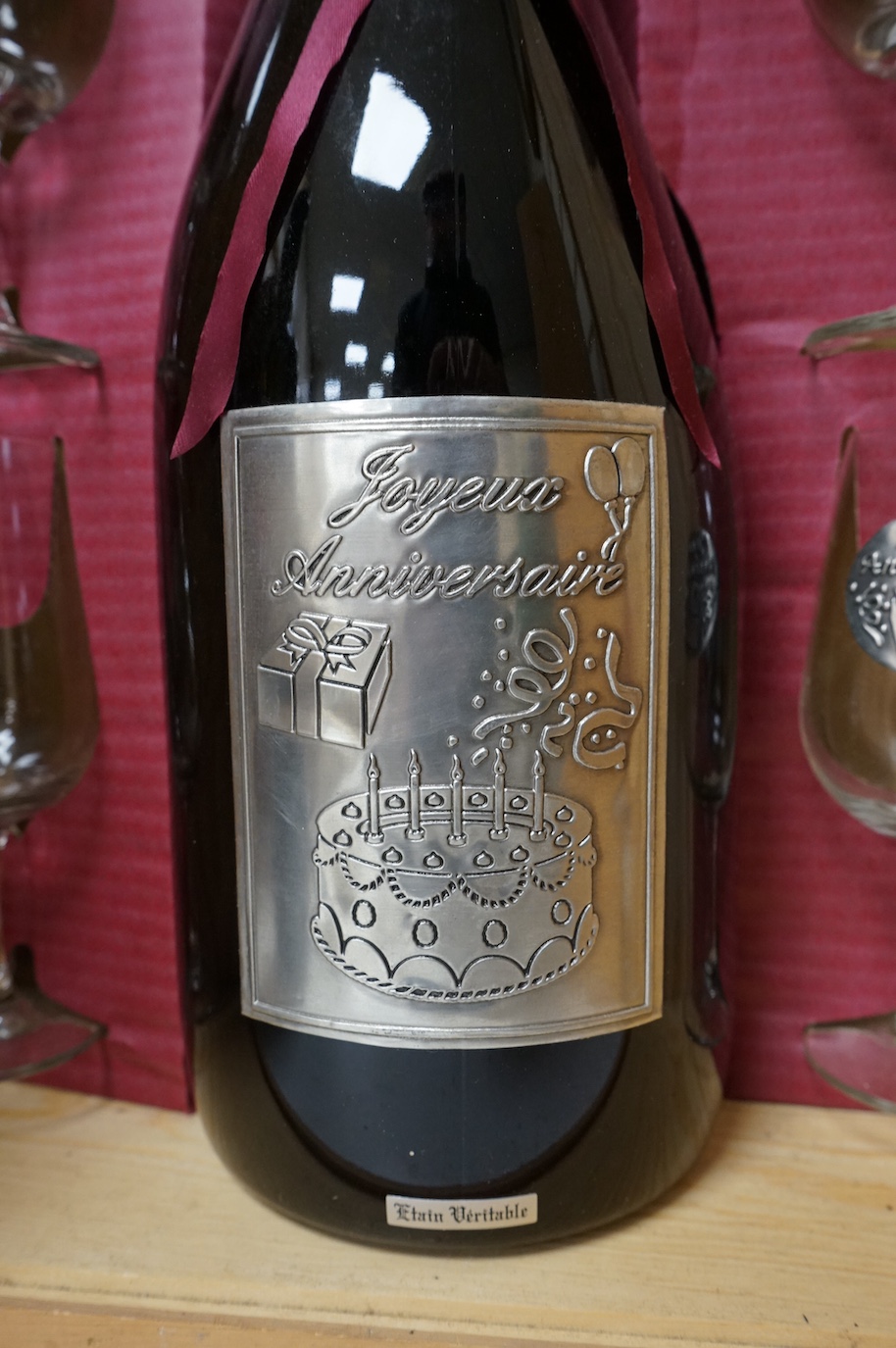 One bottle of Kummel, another, Tokaji, and a Joyeux Anniversaire, cased
